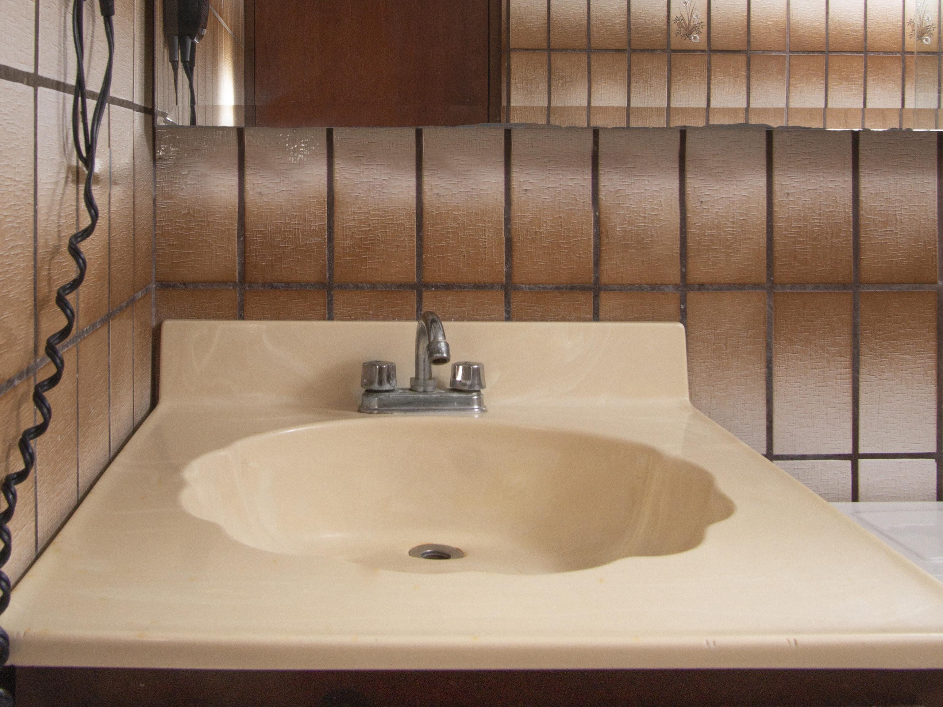 Oyo Hotel Hacienda Don Luis, Rosarito Exterior photo A typical American bathroom sink